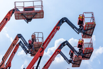Articulate boom lift with blue sky background, Aerial platform lift telescopic boom lift hydraulic boom lift, Mobile construction crane, Construction boom lifts © Kalyakan