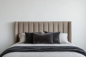 A Comfortable Bedroom Bed Features A Tall Padded Headboard And Pillows