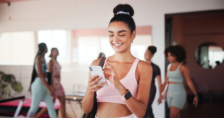 Woman, smartphone and texting at gym with smile, contact and excited with stats at fitness club. Girl, phone and mobile app for progress, report and happy for results with web chat at exercise class