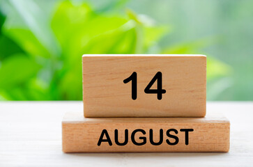 August 14 text on wooden blocks with customizable space for text or ideas. August month and calendar concept.
