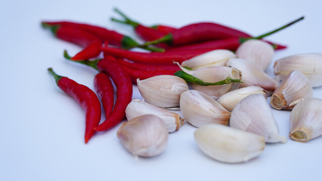 Food ingredients, chili and garlic on white. Asian cooking concept.