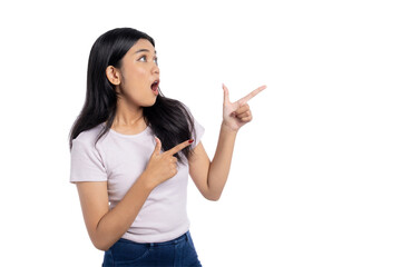 Surprised young Asian woman pointing to the side with excitement, isolated on transparent background