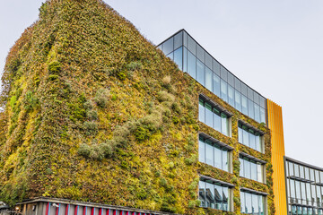 Sustainable building with green garden wall on Camden High Street. London, UK, 26 December 2023