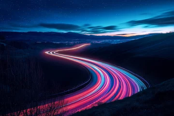 Handdoek met foto Snelweg bij nacht Night landscape, winding road with colorful light trails from moving cars, stars in the sky, mountains in the background, showcasing movement and speed at night  © PhotoArtHub