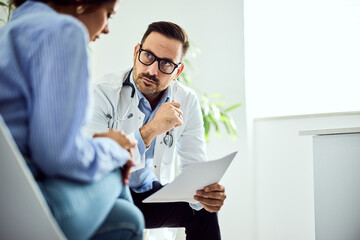Doctor Discussing Medical Results with a Female Patient in a Clinical Setting