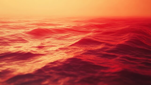 Vibrant red ocean waves with warm golden lighting