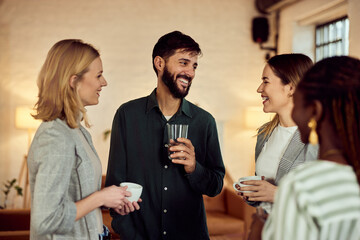 Group of Friends Socializing and Enjoying Refreshments in a Warm Gathering