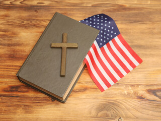 Holy Bible with a cross o and American flag. Us religion holiday concept