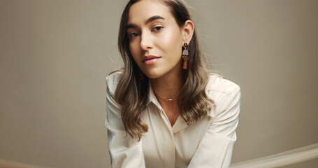 Confident, beauty and woman with makeup, glow and self expression with cosmetics, model and...