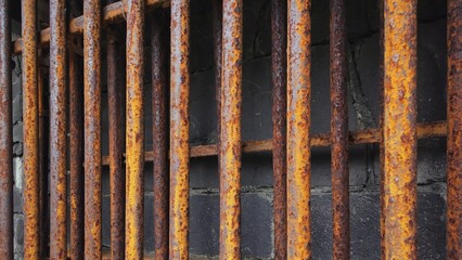 A detailed view of a weathered iron fence, ideal for use in historical or vintage-themed projects