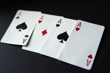 Obraz premium Playing cards arranged in a row, showing the four aces , club, arrangement