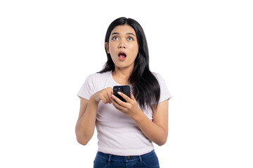 Surprised young Asian woman looking at smartphone with shocked expression, unexpected message or...