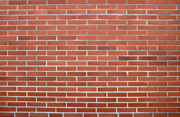 Mur de briques de couleur rouge, rose, orange