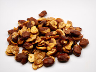 A pile of lablab beans or also known as kacang koro isolated on a white background