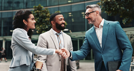 Outdoor, business people and smile with handshake for welcome, greeting or agreement for realtors. City, clients and real estate agent with shaking hands for introduction, deal success or partnership © peopleimages.com