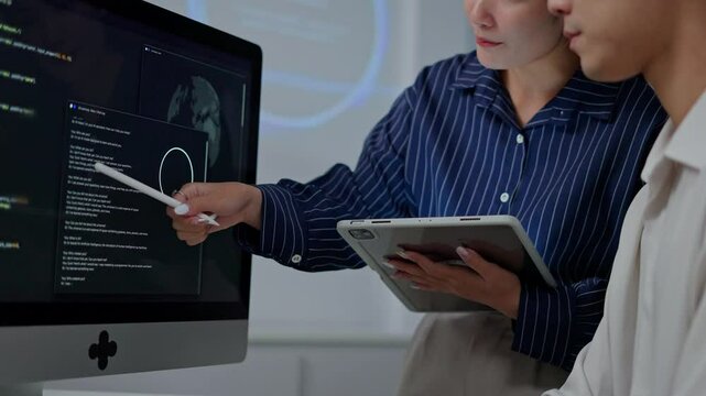 software developer talk strategy plan to executive write prompt AI bot IT app program data analytics in tech startup office.Projected visuals and glowing code on screen.AI chatbot technology concept