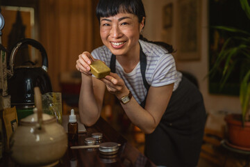 proud japanese woman look at her own product natural handmade soap