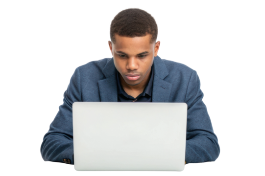 Focused young man working on a laptop while wearing a blazer in a well-lit environment