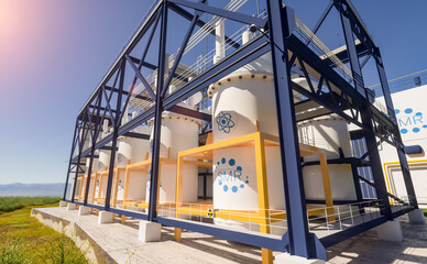concept of a SMR small modular nuclear reactor power plant on a sunny day. SMR is a future energy concept. 3d rendering.