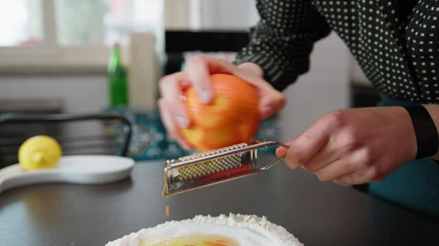 Grate Fresh Orange Fruit Zest For The Dough Of A Homemade Easter Cake