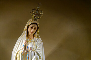 Statue of Virgin Mary, Our Lady of Fatima, with joined hands and crowned. © Joan