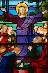 Stained glass (1926) of Jesus sends the apostles on mission.