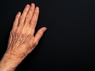 Fototapeta premium Elderly Woman's Hand Close-Up Artistic Photography Studio Detailed Texture Resilience in Aging