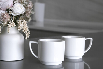 Elegant teacups on tray in luxury hotel room, morning tea service with porcelain cups against cozy accommodation backdrop