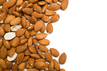 Top view of almonds on white background with copy space.