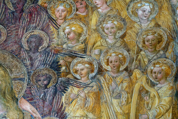 Fresco (15th century) of a choir of angels singing together in heaven. .