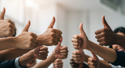 Group of diverse hands showing thumbs up, symbolizing success, approval, teamwork, positive feedback, and collaboration in a corporate or social setting.