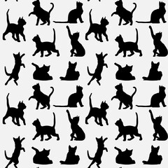 Patterns of playful cats in a seamless design for textile and wallpaper applications