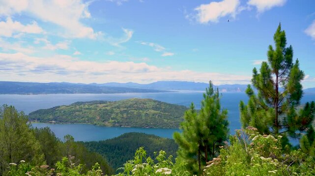 Lake Toba with a foreground of trees. Lake Toba is a large natural lake in North Sumatra