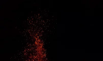 Fotobehang Brandhout Flame with sparks, Fire with floating ashes, Abstract glowing embers, Heat sparks, Bokeh fire texture  © Arteekom