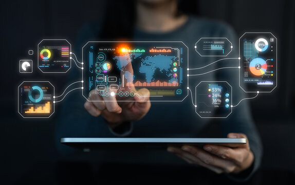 A person interacts with a digital interface displaying data visuals and analytics on a tablet, showcasing technology and innovation in data management.