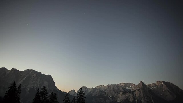 Sunrise time lapse mountain panorama Zugspitze and Ehrwalder Sonnenspitz mountains, Tyrol, Austria, high definition