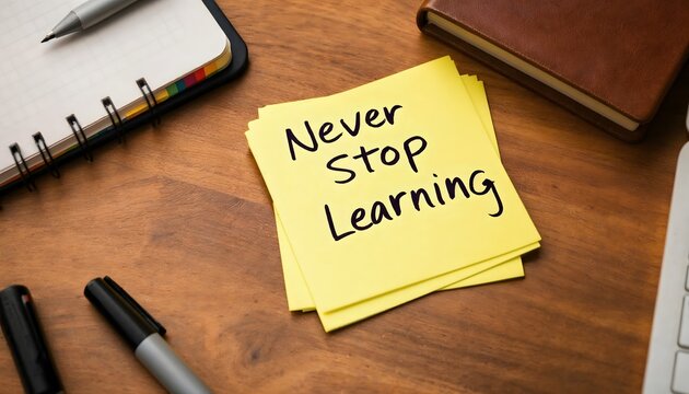 Never Stop Learning Note on Desk with Notebook and Pen