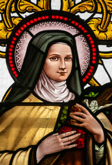Stained glass (1930) of St. Therese of Lisieux or Therese de Lisieux, Carmelite nun and Saint of the Roman Catholic Church.