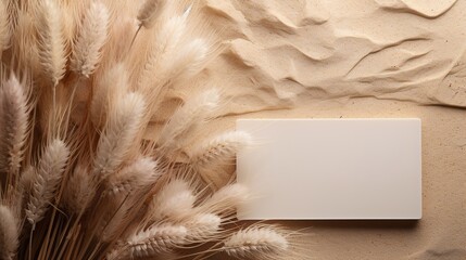 Blank card with greeting mockup next to dried pampas grass and beige travertine stones, Generative AI.