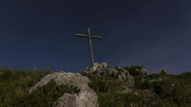 Time lapse of summit cross in the moon light at Benediktenwand mountain, Bavaria, high definition