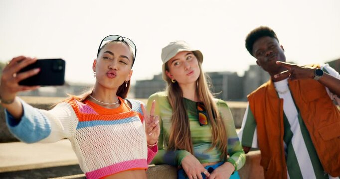 Fashion, gen z and selfie with friends in city together for summer bonding. Funny face, peace sign tongue out with smile of man and woman group on bridge in town for social media profile picture