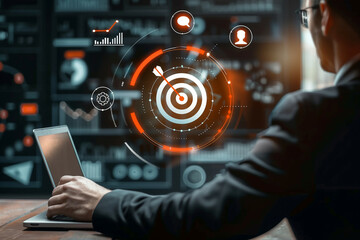 Businessman using laptop with digital target and analytics data visualization for business technology concept