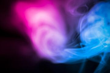 Vibrant Swirls of Colorful Smoke on a Dark Background