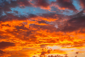 Sunset sky background photo. Dramatic orange clouds