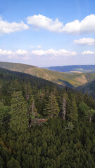 Majestic snezka mountain dominating the czech landscape under cloudy sky in august