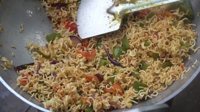 Boil water, add Maggi noodles and seasoning, cook for 2 minutes, stir well, and enjoy a quick, tasty meal.