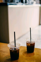 Iced coffee drinks in plastic cups. Cold and refreshing beverages for summer or takeaway.