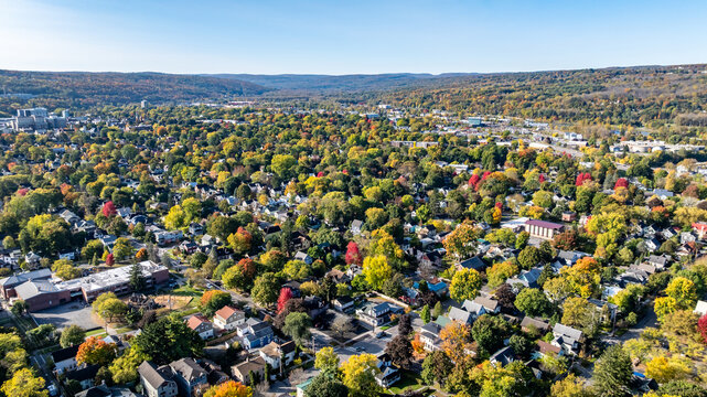 Ithaca, NY, USA - 10/18/2024 - Afternoon aerial autumn image of buildings and streets in downtown Ithaca, NY.