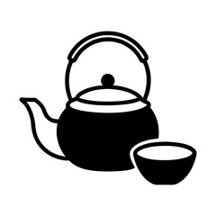 Traditional black iron teapot with a cup on a white background