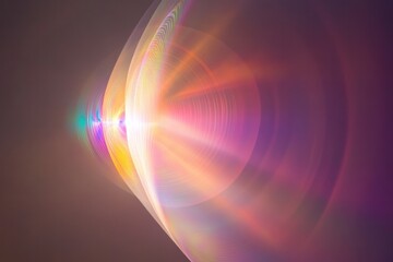 Obraz premium A gentle, swirling light pattern with a faint, multi-colored flare effect, floating in the midst of a dark, smooth gradient background.